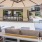 Umbrellas and outdoor sofas by the kitchen at Varela Westshore apartments