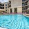Grilling courtyard with lounge chairs at Varela Westshore apartments