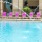 One of our outdoor pools with lounge area and fountains at Varela Westshore apartments